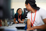 College students studying with computer in classroom