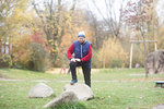 Senior woman exercising in park