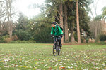 Mature woman cycling in park