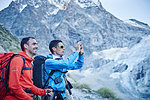 Hikers taking photograph, Mont Cervin, Matterhorn, Valais, Switzerland