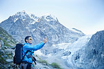 Hiker taking photograph, Mont Cervin, Matterhorn, Valais, Switzerland