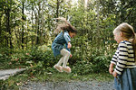 Sisters playing in forest