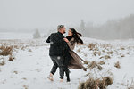 Couple dancing in snowy landscape, Georgetown, Canada