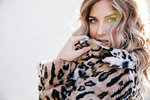 Fashionable woman in leopard print coat