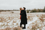 Couple kissing in snow, Georgetown, Canada