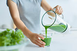 Japanese woman making smoothie in the kitchen