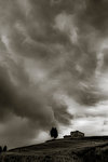 Rain storm approaching farm in Tuscany, Italy.