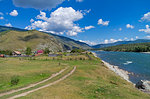 Outskirts of the Tungur village on the bank of the Katun river. Altai,  Russia. Sunny summer day.