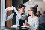 Guy and girl at a business meeting in a cafe