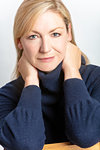 Studio portrait of attractive healthy happy thoughtful middle aged woman