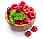 Fresh raspberry in wooden dish with green leaf vegan food Fruits and berries, isolated on white background.