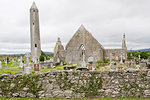 Ruins of Kilmacduagh Monastery with round tower, County Galway, Connacht, Republic of Ireland, Europe