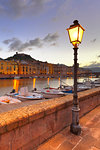 Street lamp lit along the river during twilight, Bosa, Oristano province, Sardinia, Italy, Mediterranean, Europe