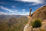 Climber looks across the Tsaranoro Massif, southern Madagascar, Africa