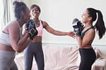 Mother teaching daughters boxing