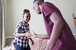 Brother and sister doing secret handshake