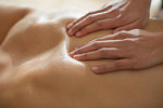 Close up woman massaging man's back