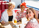Portrait confident, smiling young women friends dining in restaurant
