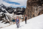 Female hikers hiking snowy mountain slope, Yoho Park, British Columbia, Canada