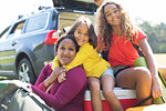 Portrait happy mother and daughters camping