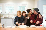 Affectionate family baking in kitchen