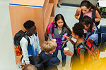 Junior high students talking in library