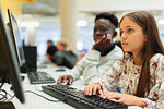 Junior high students using computer in computer lab