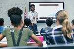 Male teacher leading lesson in classroom