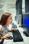 Junior high school girl student using computer in classroom