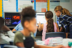 Junior high school girl students using computer in classroom