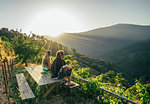 Couple enjoying sunny, idyllic hillside view, Chas de Egua, Portugal