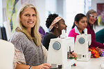 Portrait confident woman taking sewing class