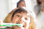 Portrait playful, silly boy brushing teeth