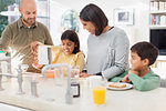 Family enjoying breakfast in kitchen