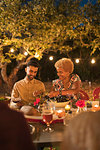 Couple enjoying dinner garden party