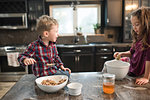 Children eating on kitchen worktop