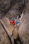 Climber trad climbing, Pine Creek, Bishop, California, USA