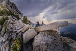 Climber resting on peak, Tuolumne Meadows, Yosemite National Park, California, United States