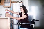 Woman in wheelchair at home