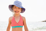 Cute girl in sunhat on beach, portrait, Portoferraio, Tuscany, Italy