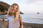 Blond haired girl on beach, portrait, Portoferraio, Tuscany, Italy