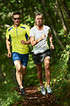 Joggers running in forest