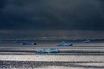 Ice floe seascape under storm clouds, Erik Eriksenstretet strait separating Kong Karls Land from Nordaustlandet, Svalbard Islands, Norway