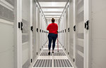 Woman with a damaged hip joint working in data centre