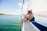 Young couple sailing on Chiemsee lake, Bavaria, Germany