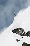 Male skier speeding down steep mountainside, Alpe-d'Huez, Rhone-Alpes, France