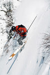 Male skier speeding down vertical mountainside, Alpe-d'Huez, Rhone-Alpes, France