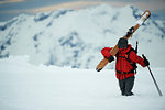 Landscape with male skier trudging in deep snow, Alpe-d'Huez, Rhone-Alpes, France