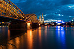 Dome Cathedral, Hohenzollern bridge and theater along Rhine river at night, Cologne, Nordrhein-Westfalen, Germany