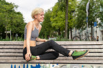 Young woman resting on bench in park